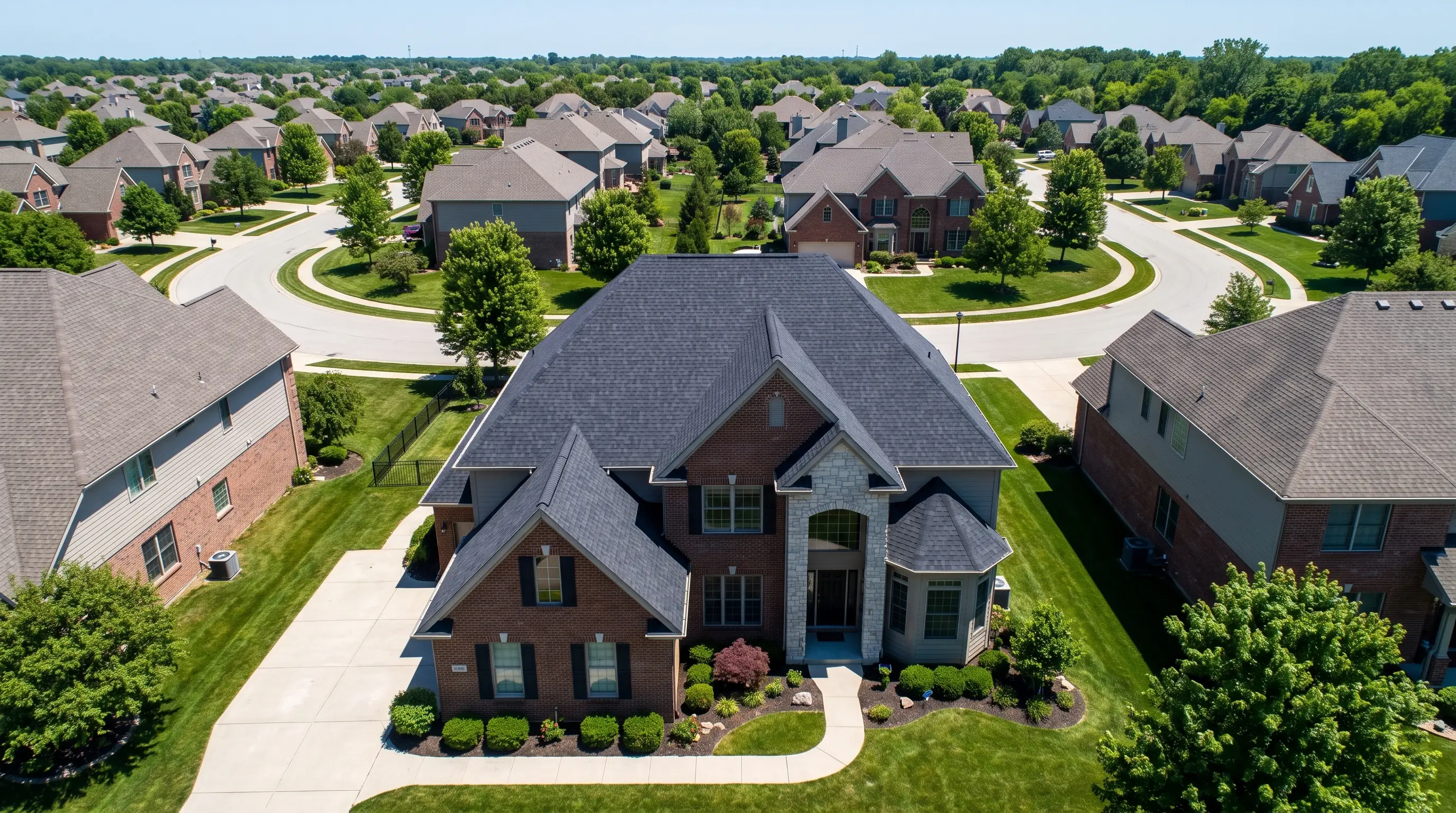 Aerial view of a suburban roof during a professional roofing assessment